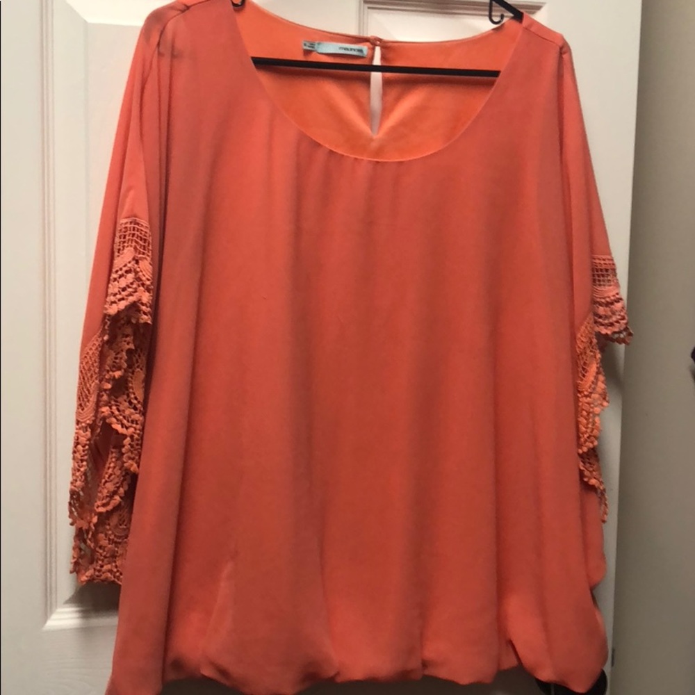 Coral blouse with lace sleeves